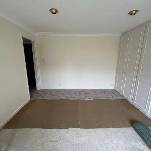 Old, dusty bedroom carpet before replacement with laminate flooring in Kidlington, Oxfordshire.